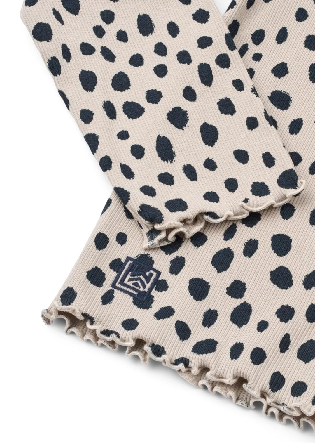 Nieve blusa, Leo Spots